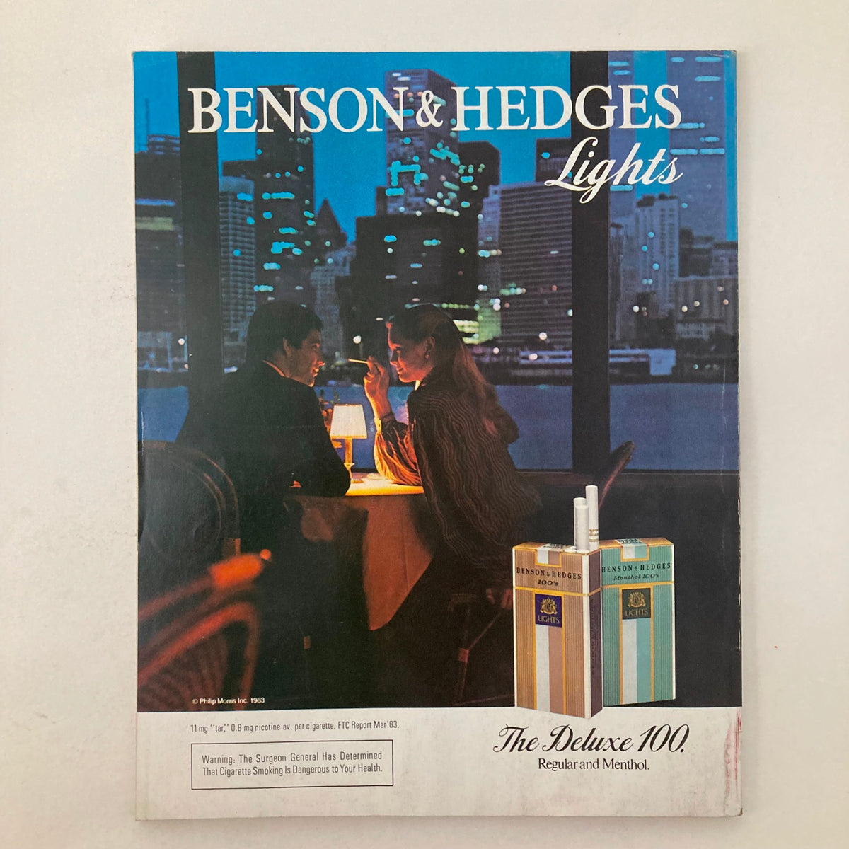 Advertisement page in Vintage Vanity Fair Magazine March 1984 featuring Benson & Hedges Lights cigarettes, emphasizing a romantic dinner setting.