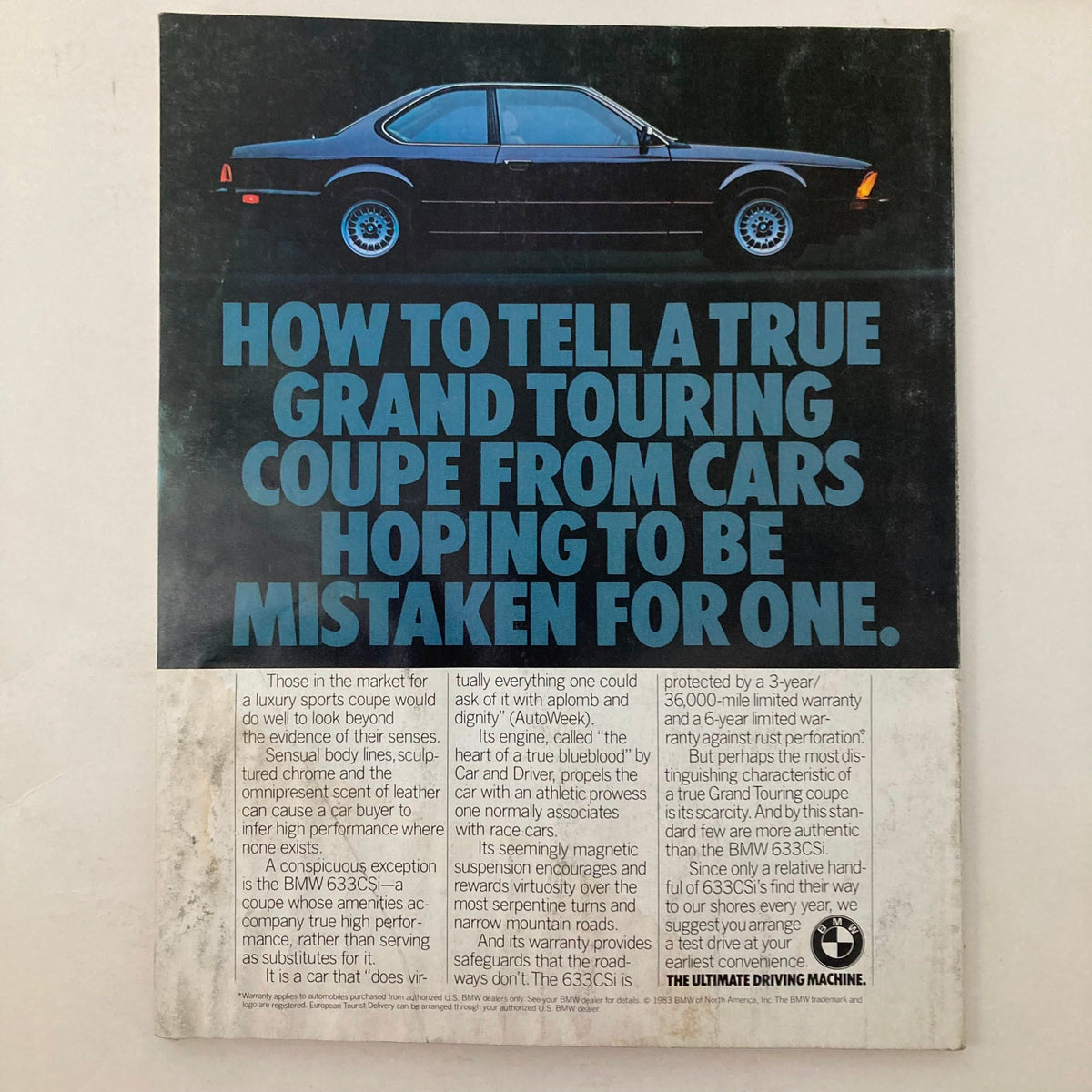 Back cover of the July 1983 Vanity Fair Magazine featuring an advertisement for the BMW 633CSi, providing details on its performance and features. Title: VTG Vanity Fair Magazine July 1983 George Washington by Red Grooms No Label.