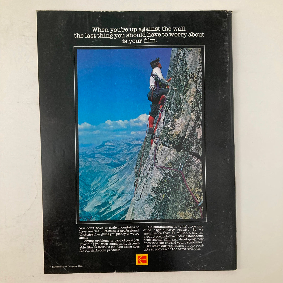 American Photographer Magazine February 1982 - Back cover advertisement with a climber on a rocky mountain wall promoting dependable Kodak film for professional photographers.