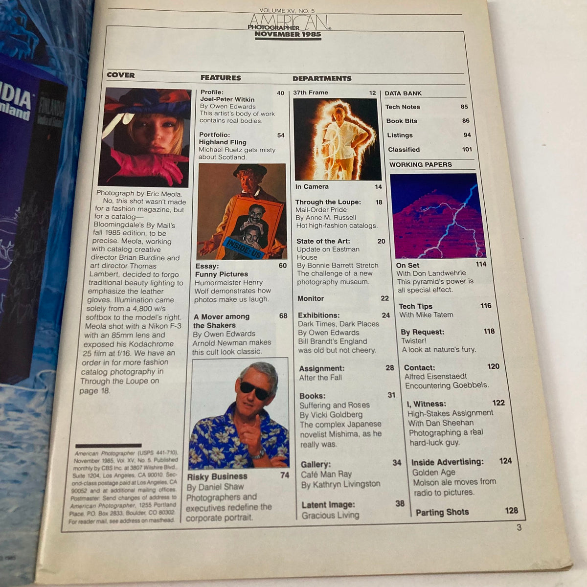 Table of contents from the November 1985 issue of American Photographer Magazine, listing articles including a profile on Joel-Peter Witkin, showcasing the magazine's features and departments.