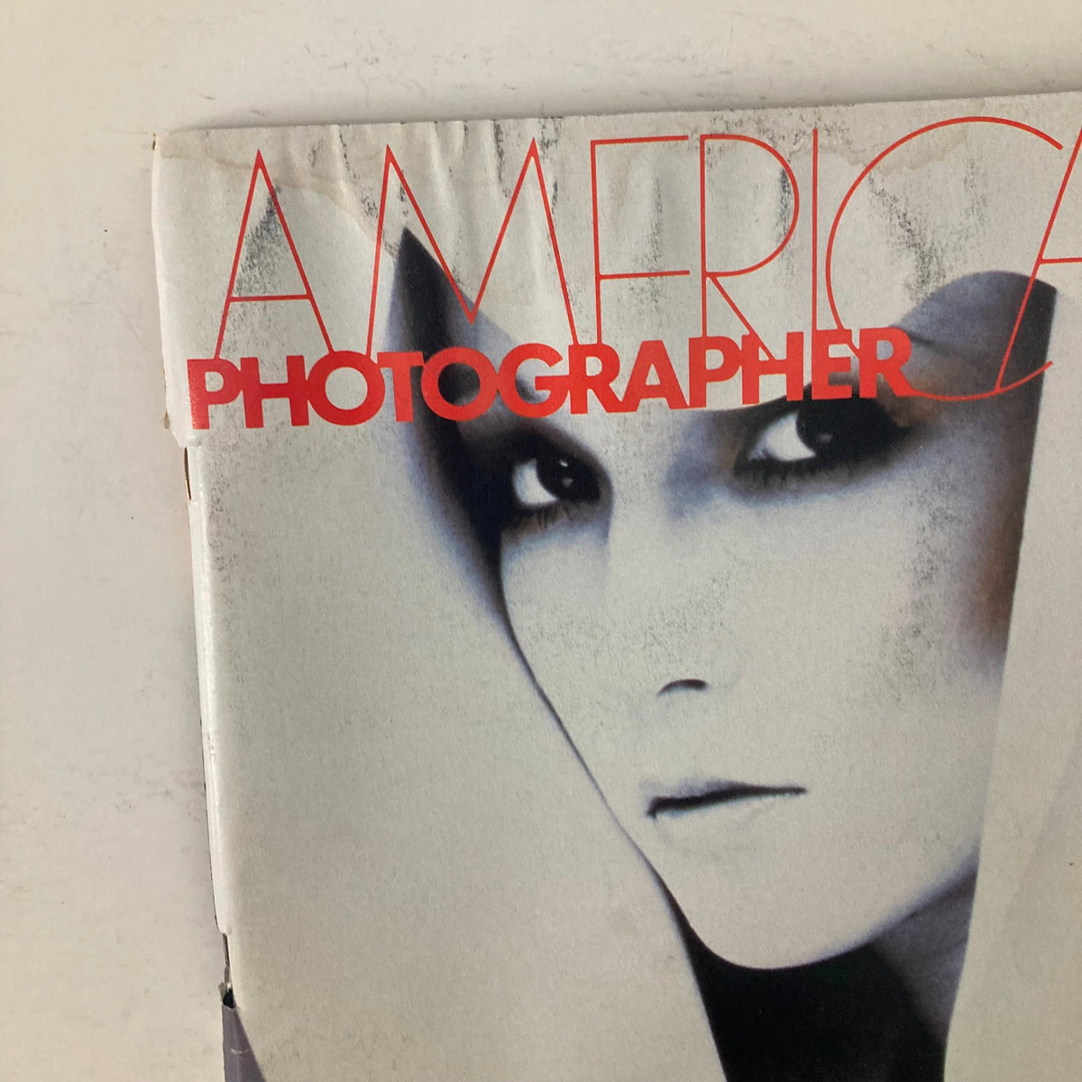 Close-up view of the cover of American Photographer Magazine November 1983, showcasing the Pola Cosmetics theme and the mesmerizing image by photographer Hideki Fuji.