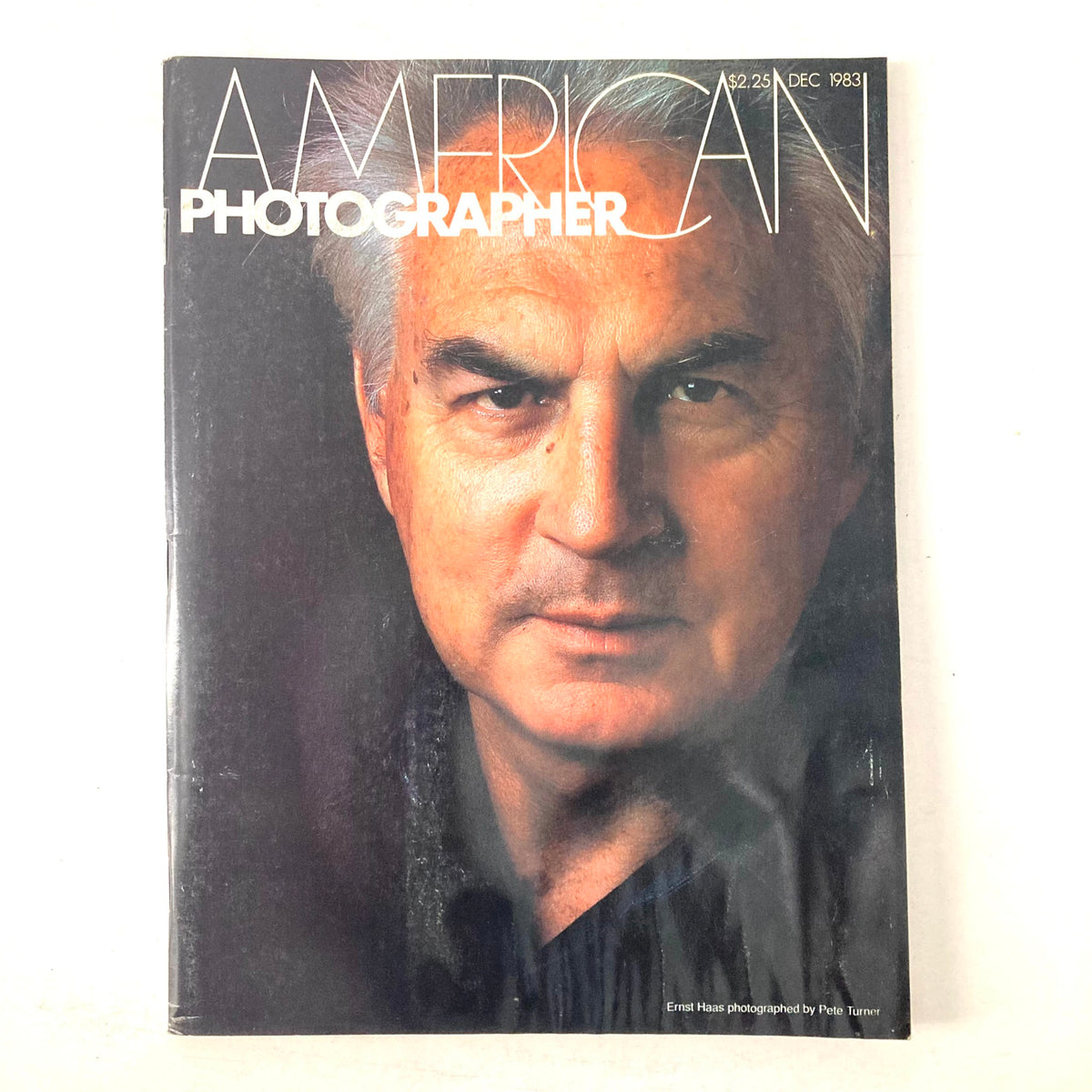 Cover of American Photographer Magazine December 1983 featuring Ernst Haas photographed by Pete Turner, showcasing vintage photography art and culture.