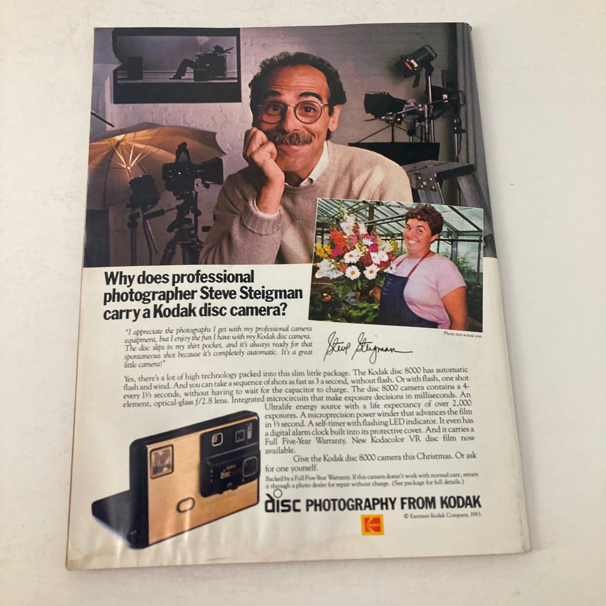 Advertisement page from American Photographer Magazine December 1983, showcasing professional photographer Steve Steigman's endorsement of Kodak disc cameras.