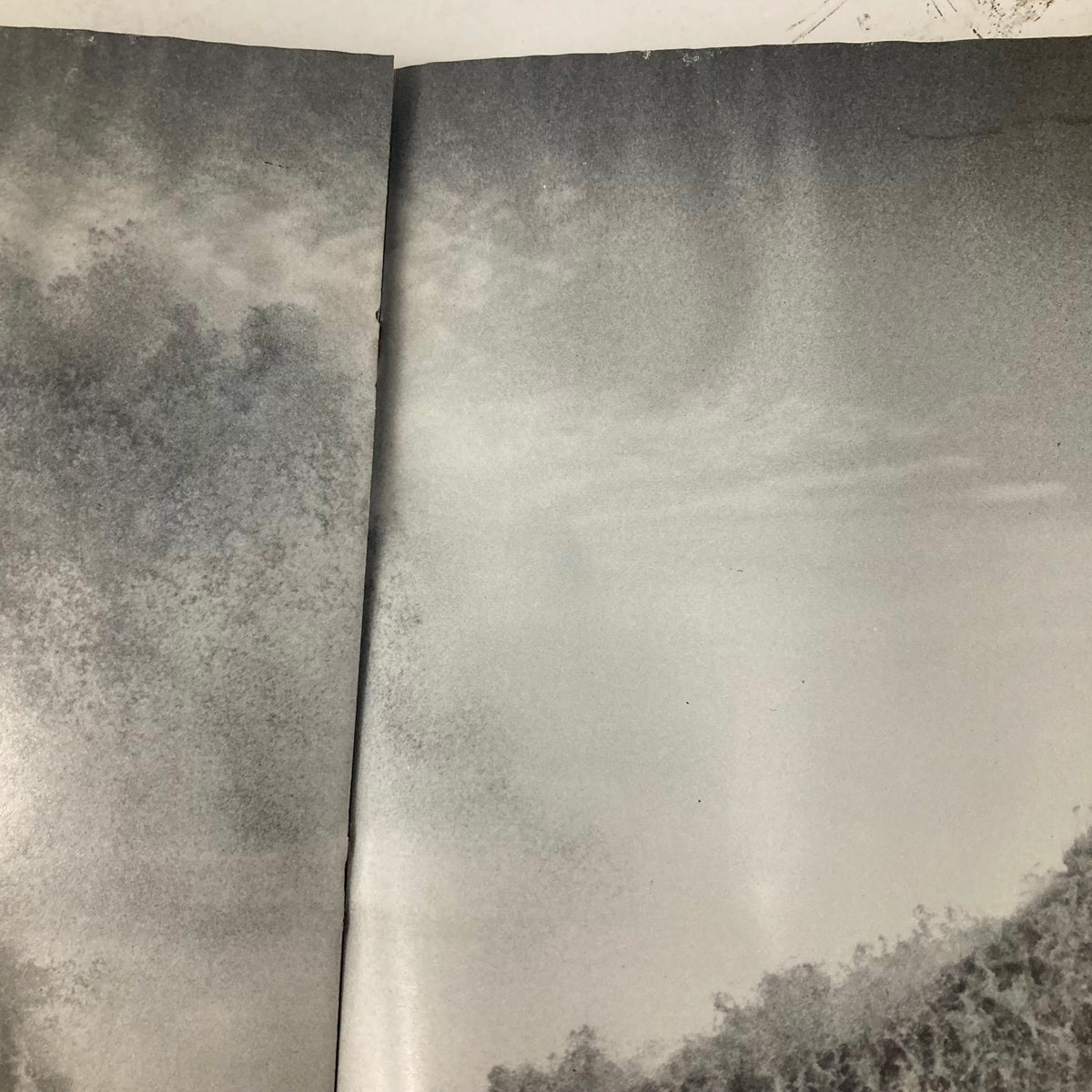Interior pages of the American Photographer Magazine April 1985, displaying a cloudy photography scene, reflecting the magazine's vintage aesthetic.