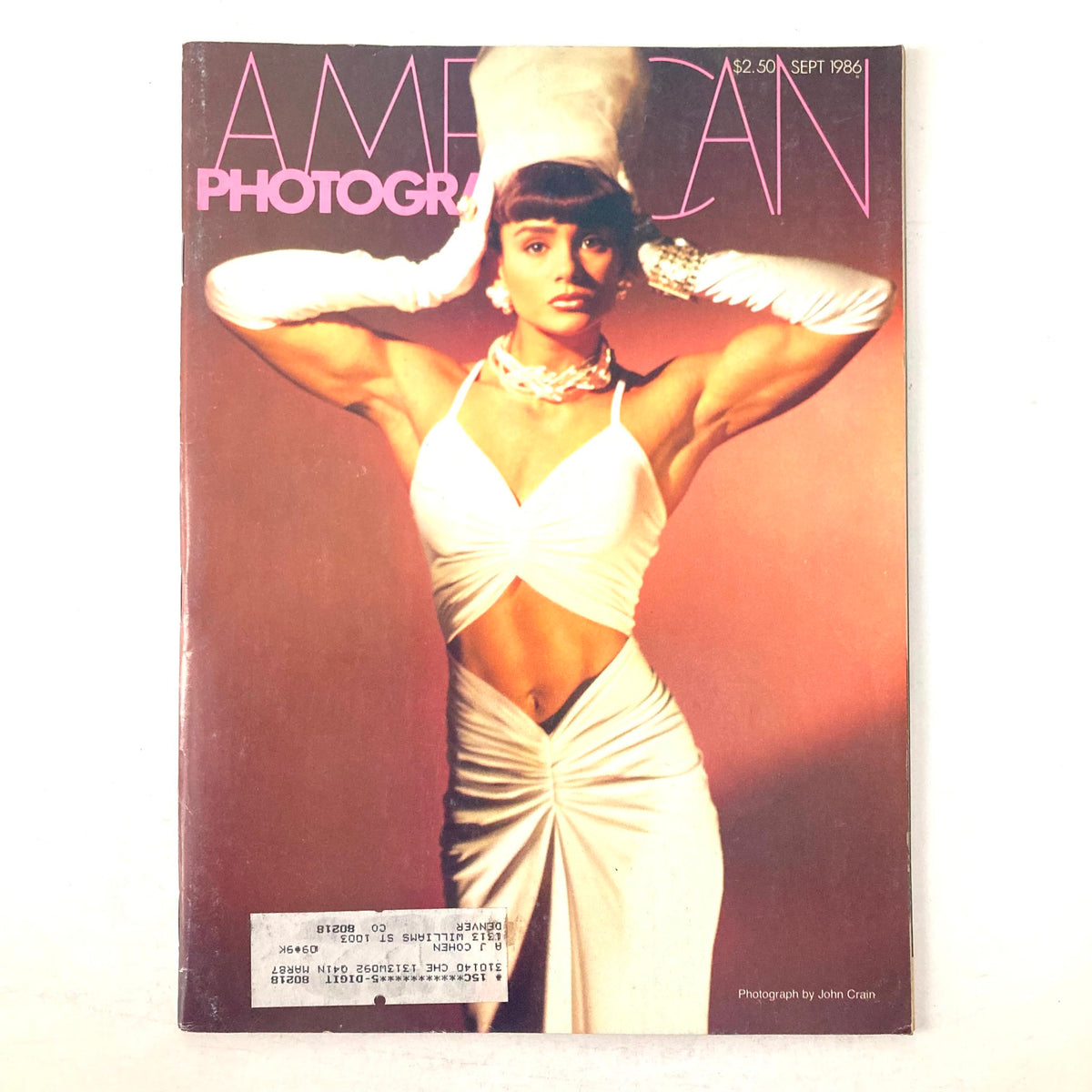 Cover of American Photographer Magazine September 1986 featuring bodybuilder Gladys Portugues in a striking pose, showcasing her muscular physique and fashion style.