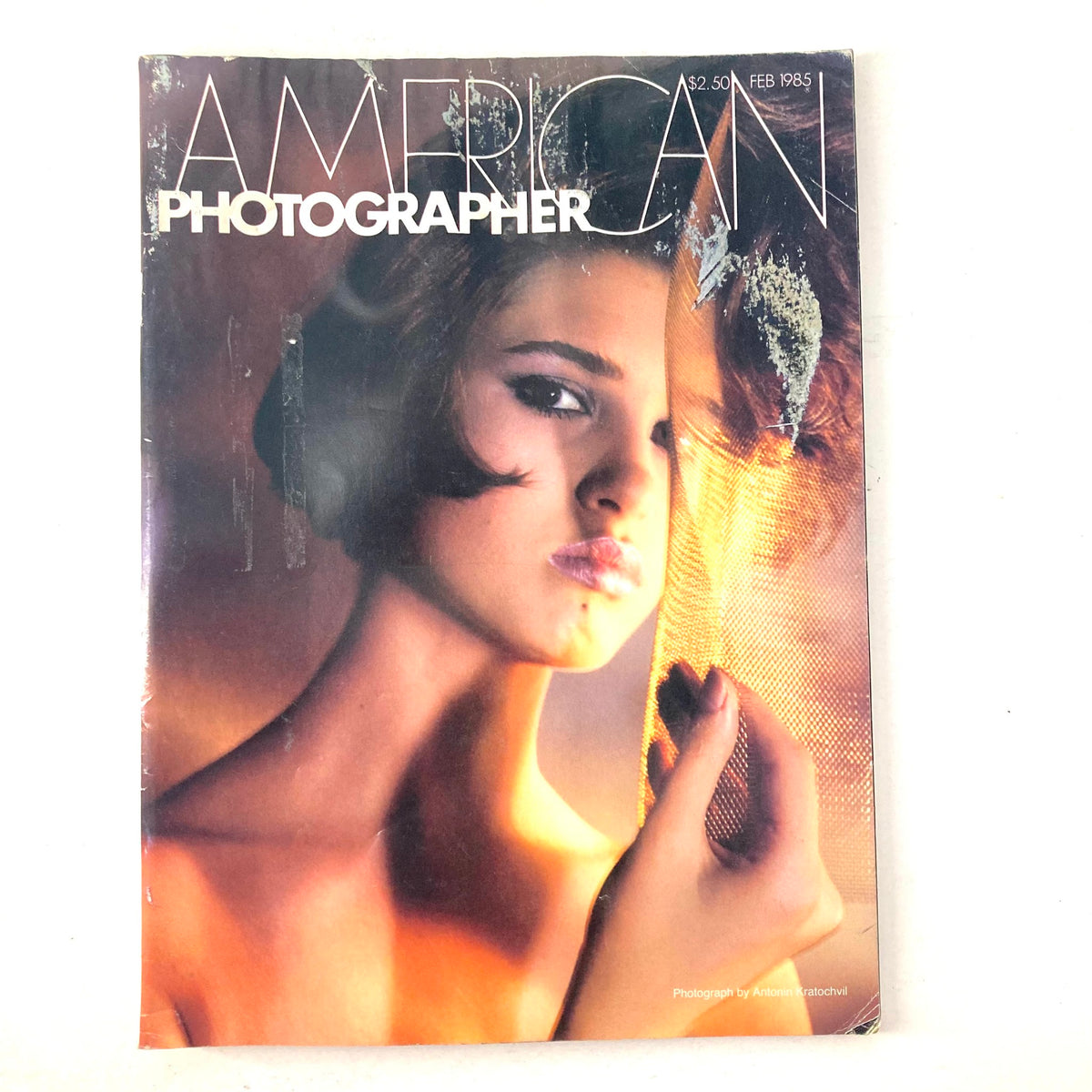 American Photographer Magazine February 1985 cover featuring Elite Model Sam Jenkins, showcasing vintage fashion photography.