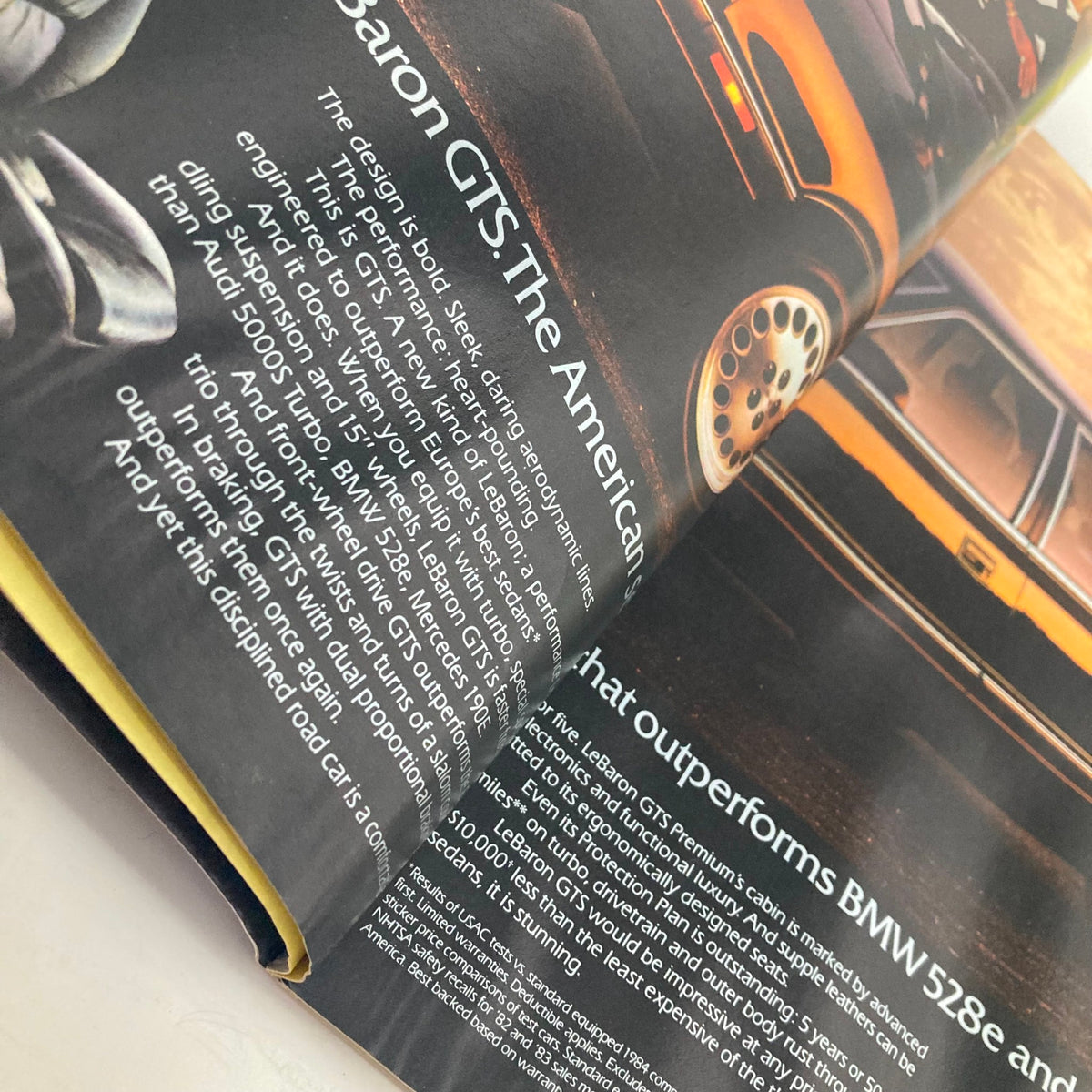 Close-up view of an article in American Photographer Magazine March 1985 discussing the design and performance of vehicles, showcasing a section on Baron GTS.