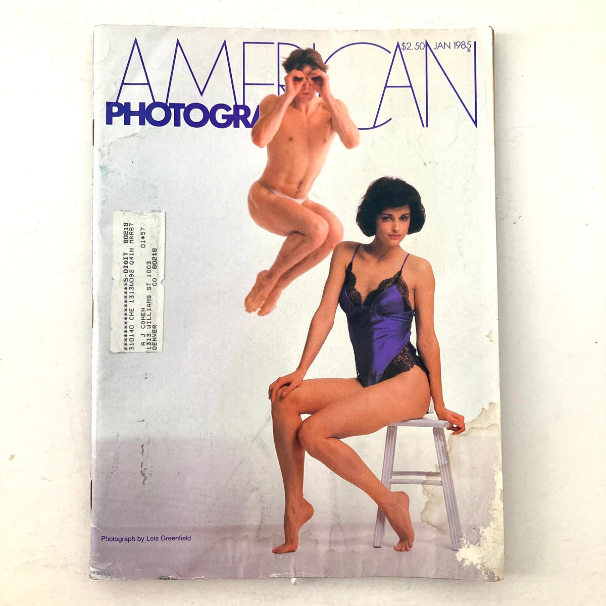 Cover of American Photographer Magazine January 1985 featuring a striking photograph by Lois Greenfield of a male dancer in mid-air and a female model in a purple outfit.