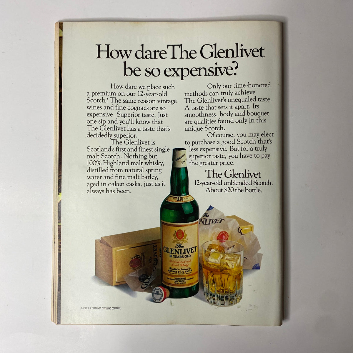 Back cover of Forbes Magazine February 28, 1983 advertising Glenlivet 12-year-old Scotch with a bottle and glasses, noting its quality and price.
