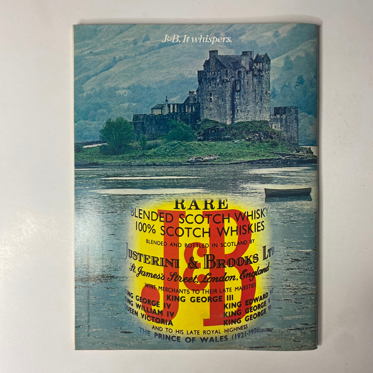 Cover of a vintage publication showcasing a picturesque landscape with a castle, featuring a label for J. & B. rare blended Scotch whisky, designed to attract collectors and enthusiasts.