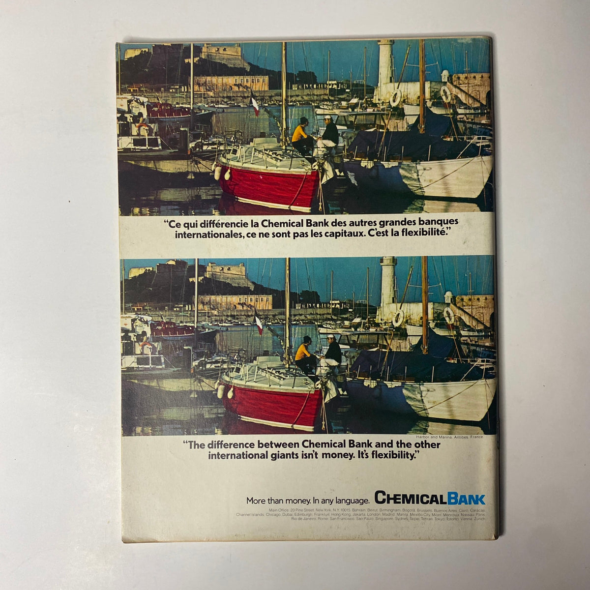 Back cover of Forbes Magazine, June 1, 1977, featuring a vibrant harbor scene with boats, emphasizing a quote about Chemical Bank's flexibility compared to other international banks. This image complements the article on Union Pacific's Golden Prospects, showcasing financial insights from a transformative era.