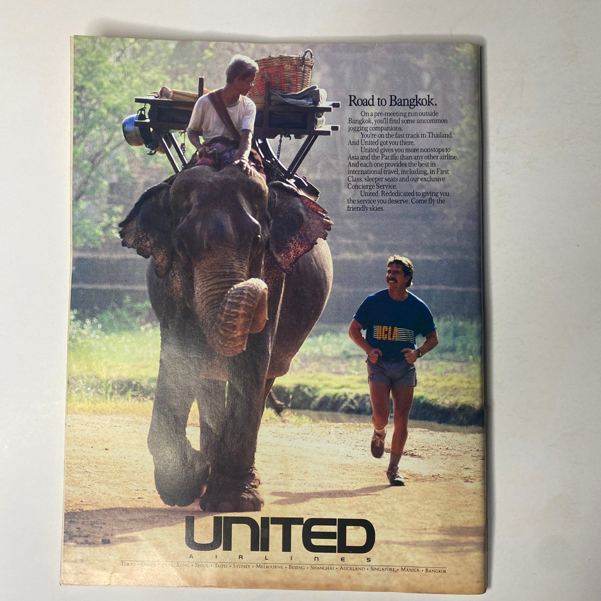 Vintage advertisement in Forbes Magazine dated July 10, 1989, showcasing a United Airlines promotion with an elephant, exemplifying travel and promotional themes from the late 1980s.