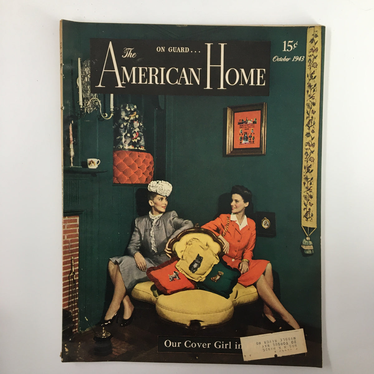 Cover of VTG The American Home Magazine, October 1943 featuring two women in stylish outfits, surrounded by vintage decor, and the caption 'Our Cover Girl in'. This magazine explores home design and decor themes from the 1940s.