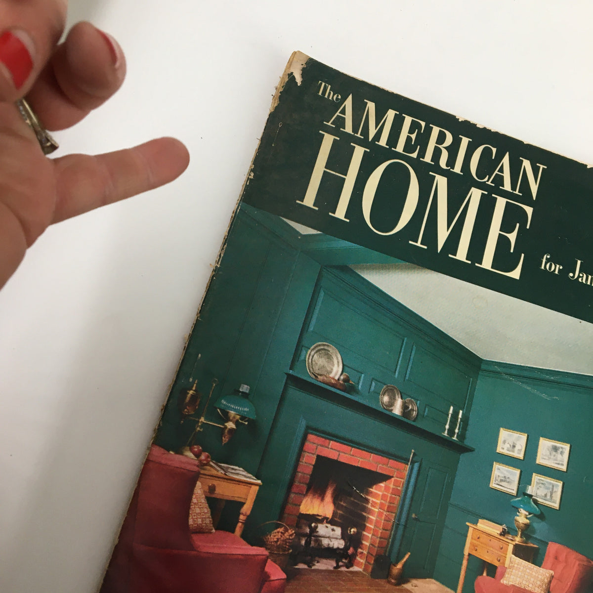 Cover of VTG The American Home Magazine January 1952, featuring a cozy living room with a fireplace and teal walls.