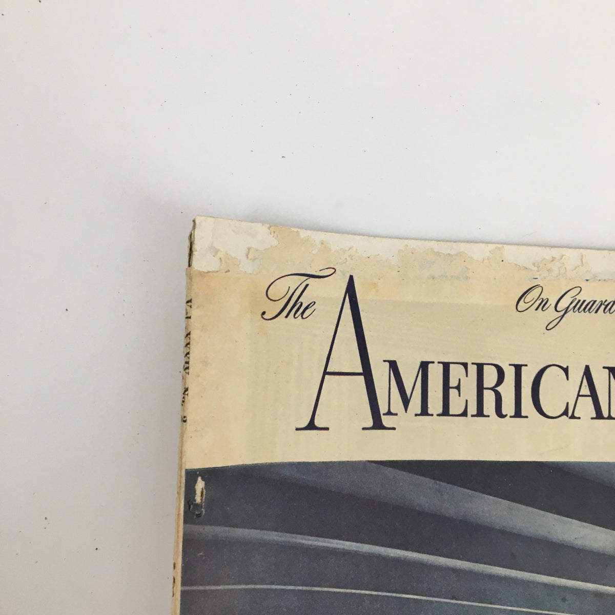 Close-up of the title section of VTG The American Home Magazine July 1945, highlighting the magazine's name and vintage wear, including visible aging and marks.