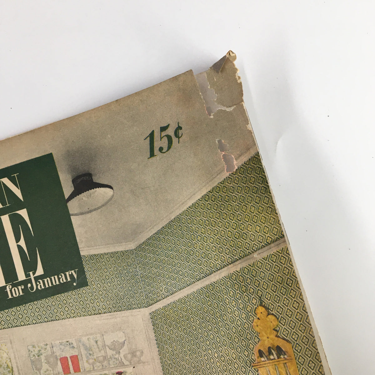 Top corner detail of the VTG The American Home Magazine January 1947 cover showing the price of 15 cents and a glimpse of vintage wallpaper.