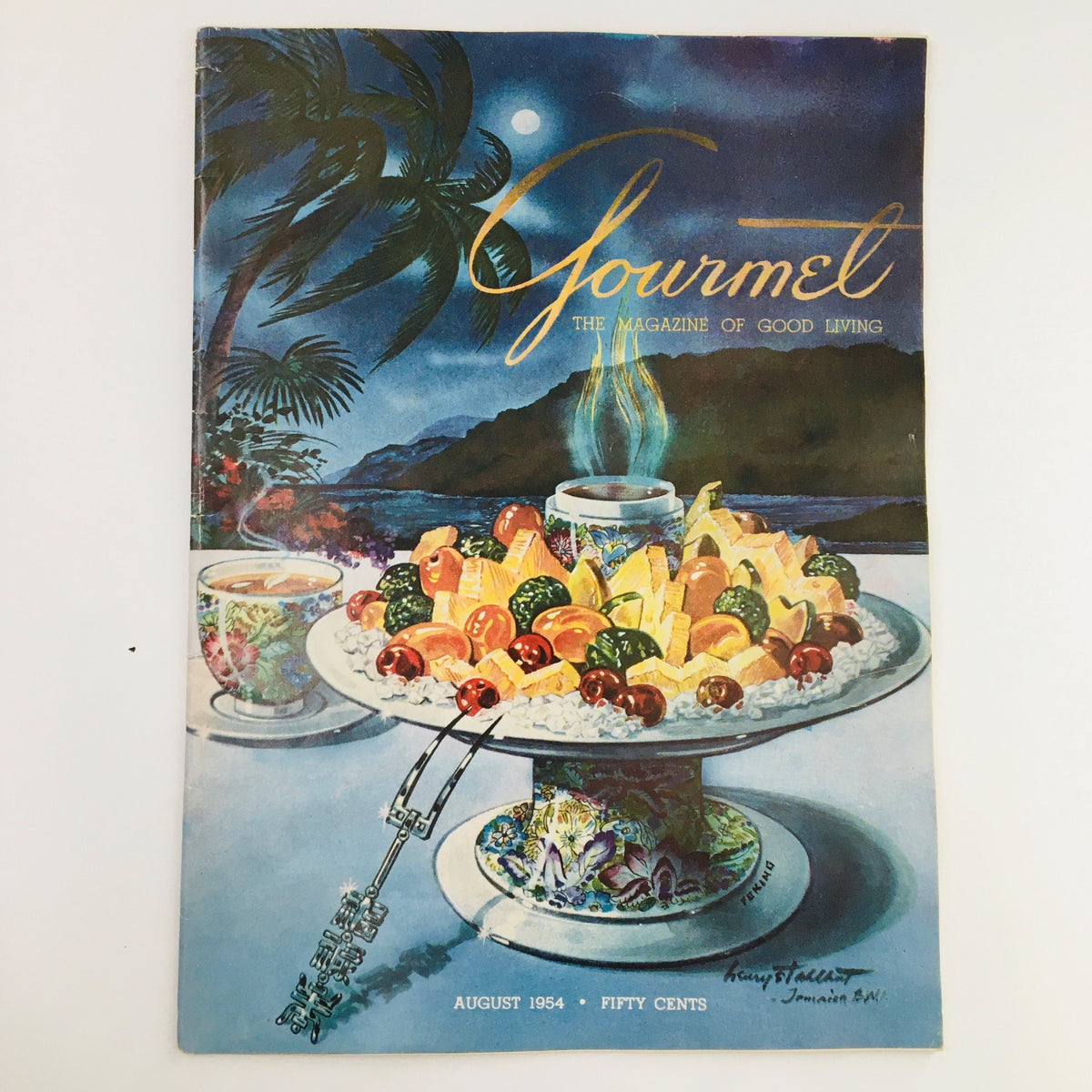 Cover of Gourmet Magazine August 1954 featuring vibrant illustration of fruit platter and tropical setting, titled 'They Called It Kill Devil'.