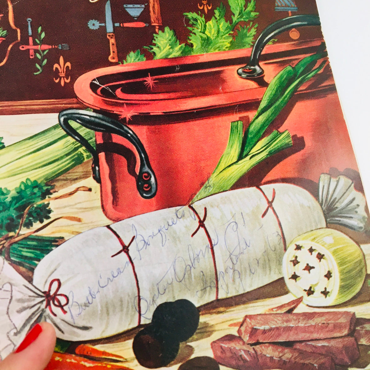 Gourmet Magazine April 1954 Vol 14 #4 showcasing a culinary scene with a vintage red pot and ingredients like celery, illustrating the charm of mid-20th-century cooking.