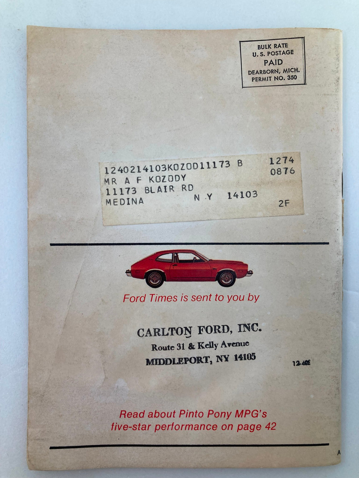 Back cover of VTG Ford Times Magazine August 1976, Volume 69, Issue #8, displaying a mailing address sticker and vintage car illustration, capturing the essence of automotive history.