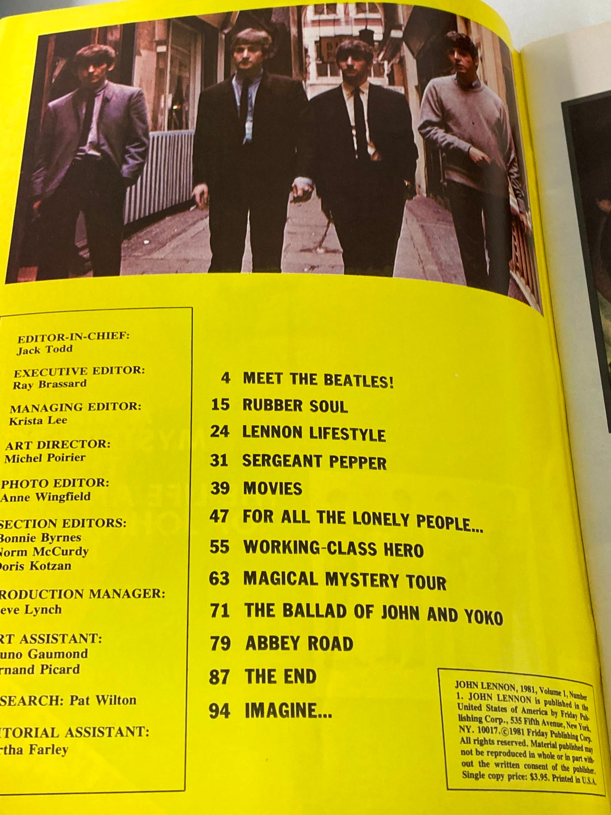 Inside page of the 1981 The Beatles' John Lennon 1940-1980 A Memorial Album showing the table of contents with iconic song titles and highlights.