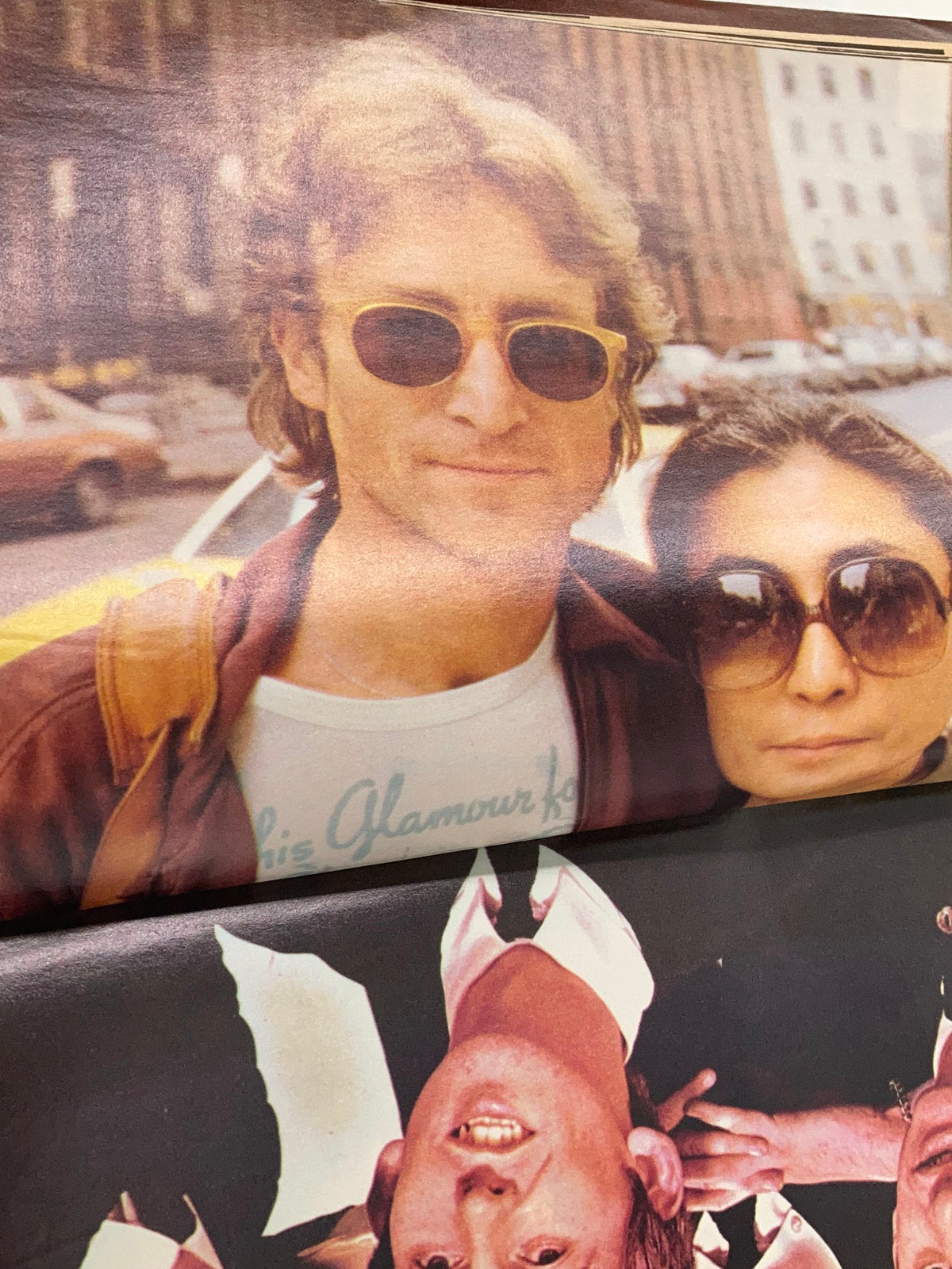 John Lennon and Yoko Ono Posing in Sunglasses in a Candid Moment from the 1981 John Lennon Beatles Memory Book, A Tribute to The Fab Four.