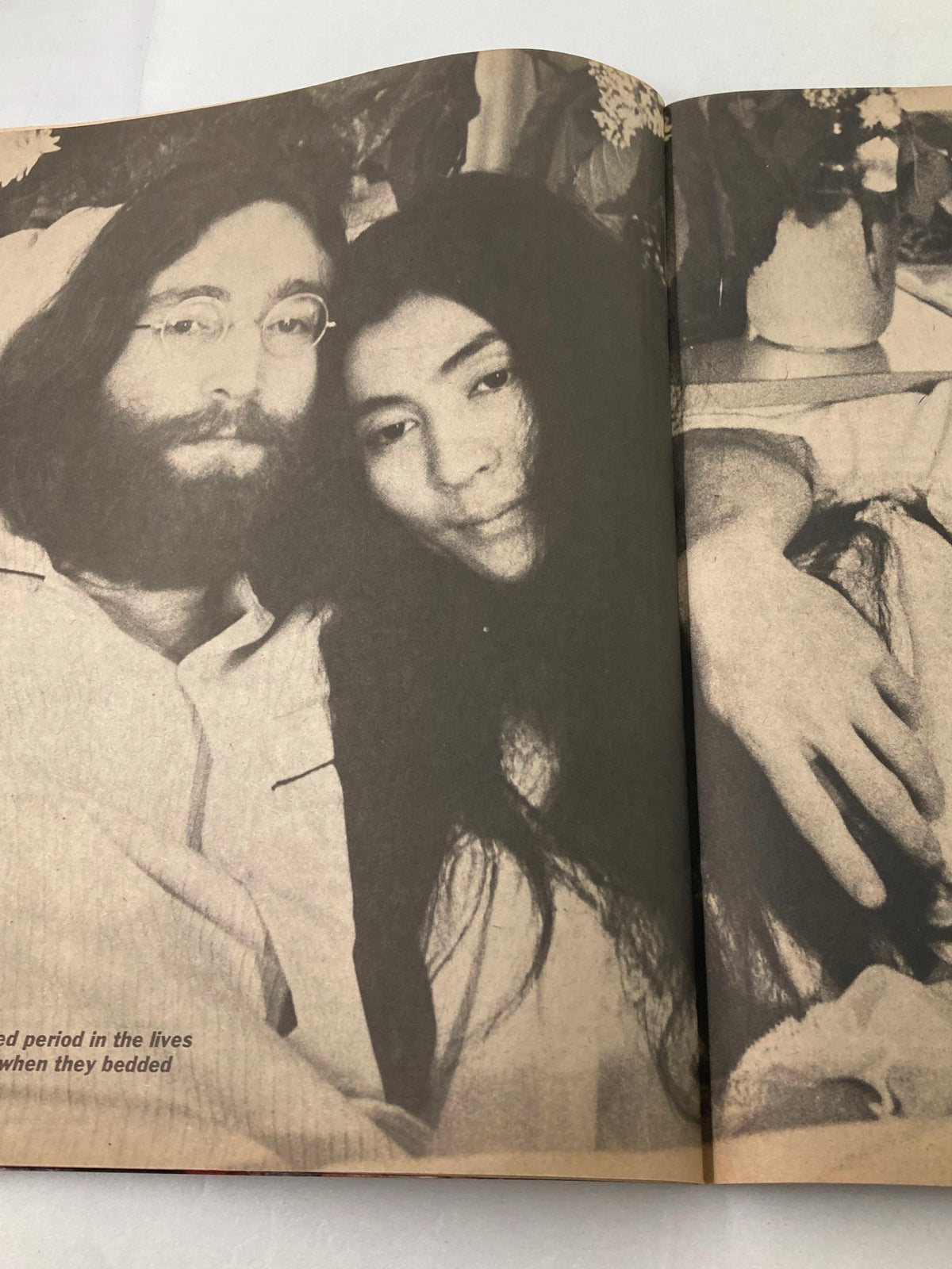 Image from the 1981 John Lennon Beatles Memory Book featuring John Lennon and Yoko Ono, capturing a moment of intimacy, reflecting their love and collaboration.