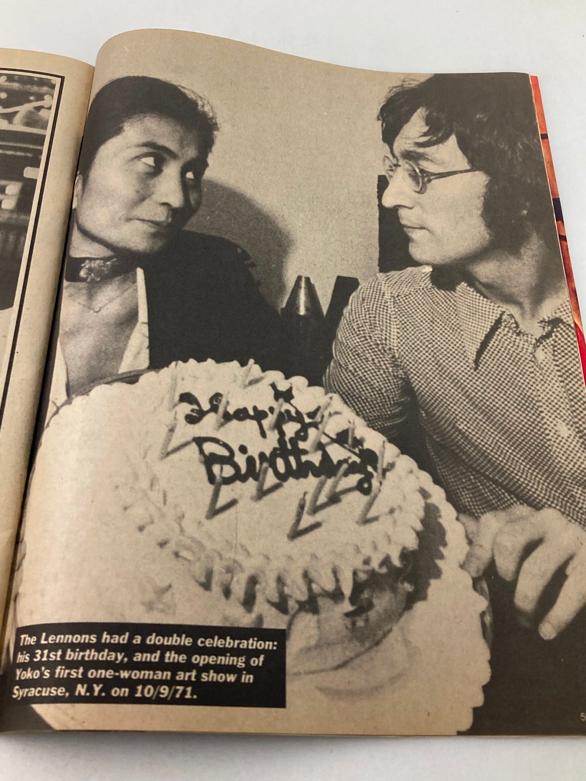 Image from the 1981 John Lennon Beatles Memory Book of John Lennon celebrating his 31st birthday with Yoko Ono, commemorating a significant moment in their lives.