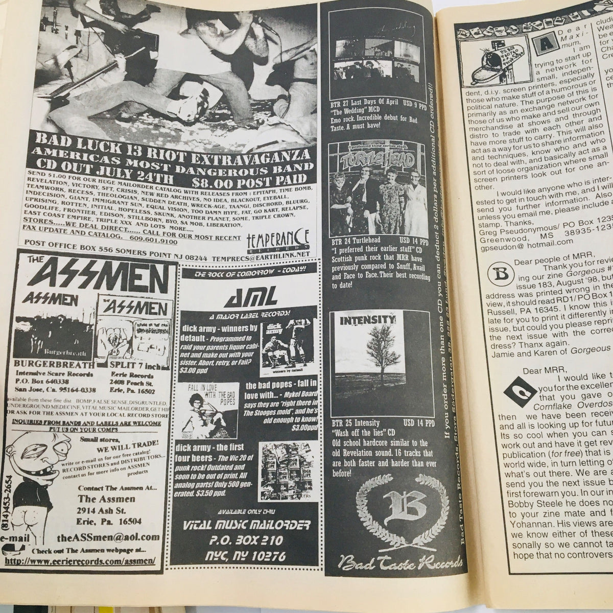 Interior page of Maximum RocknRoll Magazine October 1998 showcasing advertisements and punk rock event listings.
