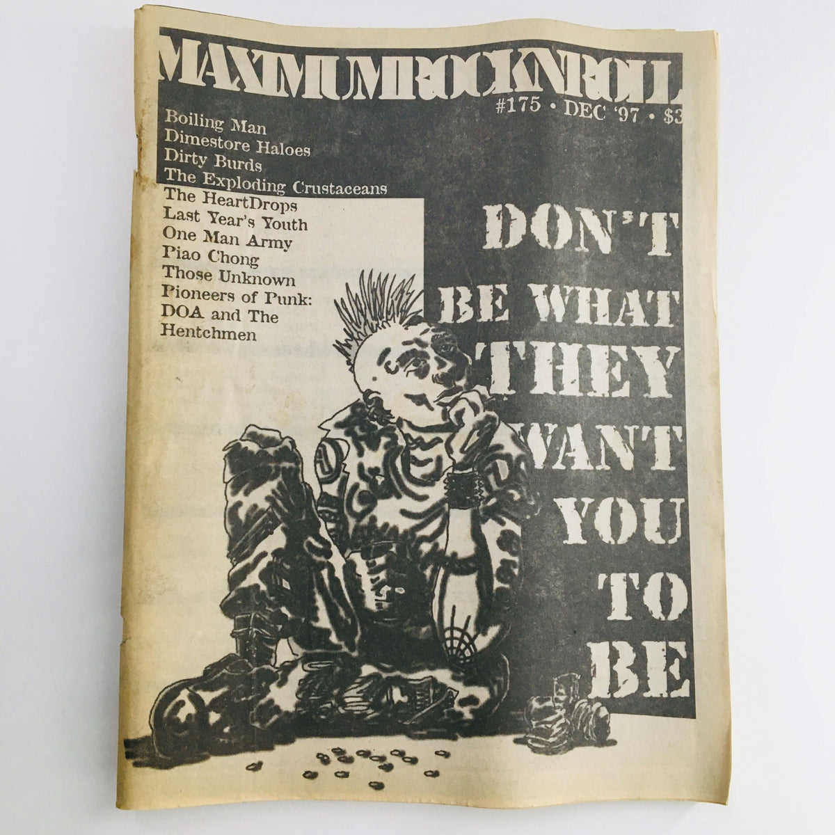 Cover of Maximum RocknRoll Magazine December 1997 issue #175 featuring the titles 'Boiling Man', 'Dirty Burds', and a punk illustration with the phrase 'DON'T BE WHAT THEY WANT YOU TO BE'.