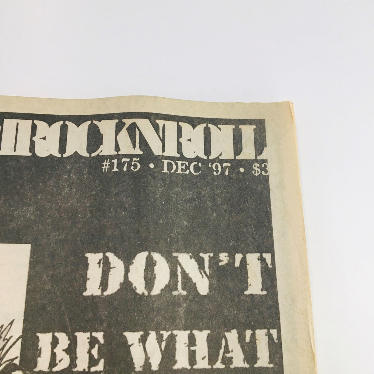 Close-up of the Maximum RocknRoll Magazine December 1997 issue #175 cover highlighting the title and the phrase 'DON'T BE WHAT THEY WANT YOU TO BE'.