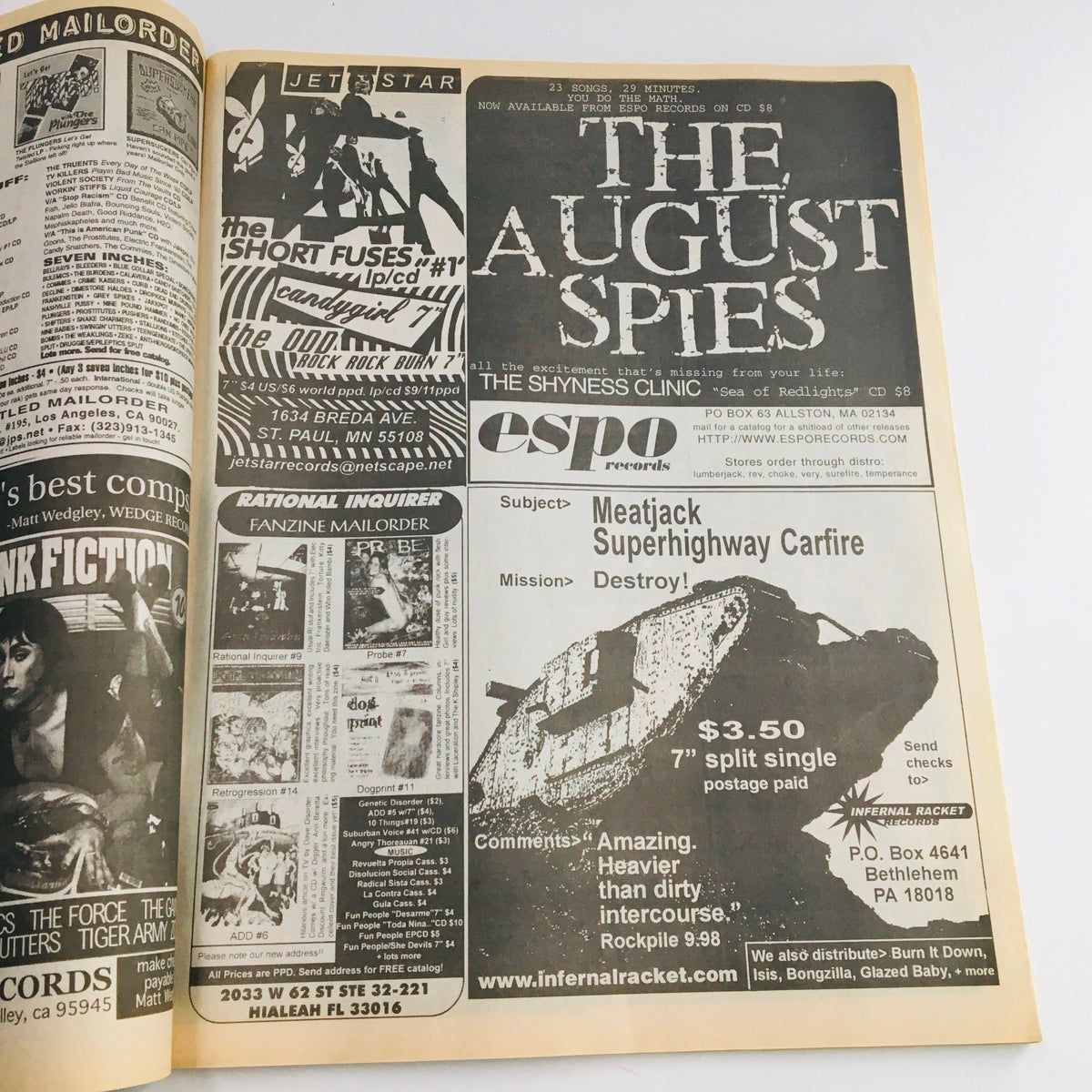 Advertisement page from Maximum RocknRoll Magazine December 1999 #194 featuring various punk music fanzines and record promotions.