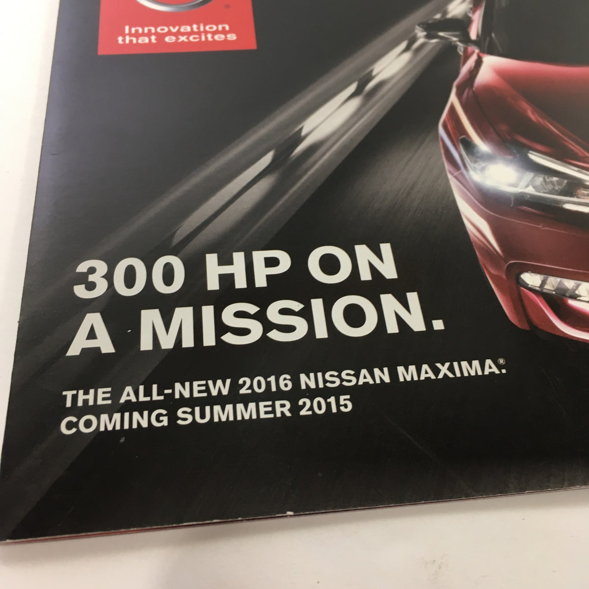 Close-up of the 2016 Nissan Maxima 300-HP On A Mission brochure detailing the all-new Nissan Maxima, highlighting engine power and release summer 2015.