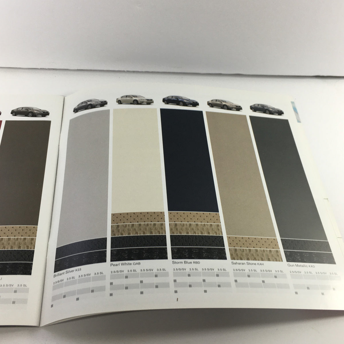 Color palette page from the 2015 Nissan Altima Sedan Dealership Car Auto Brochure Catalog showcasing paint options including Pearl White, Storm Blue, and Gun Metallic.
