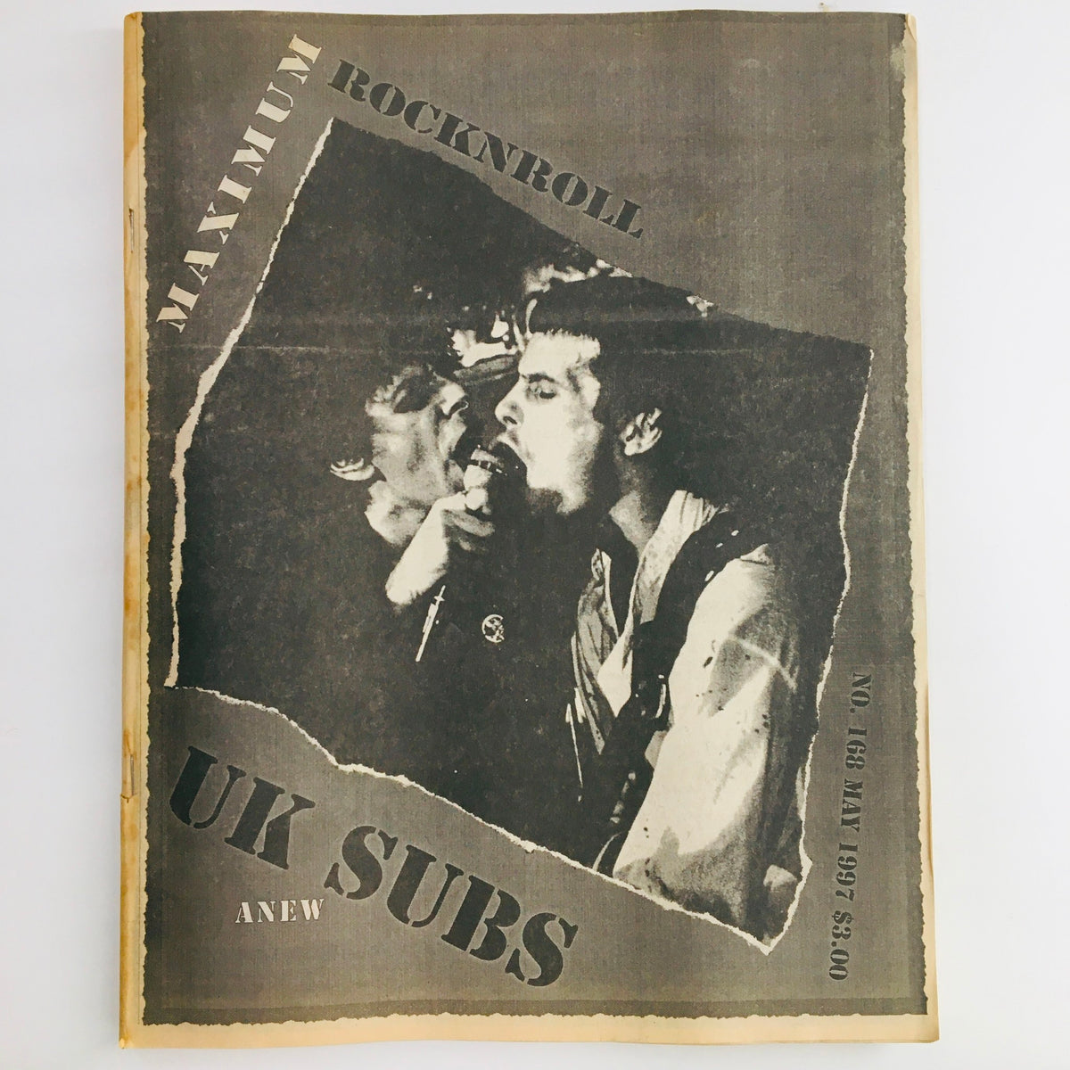 Cover of Maximum RocknRoll Magazine May 1997 #168 featuring U.K. Subs rock band, showcasing a dramatic black and white photo.