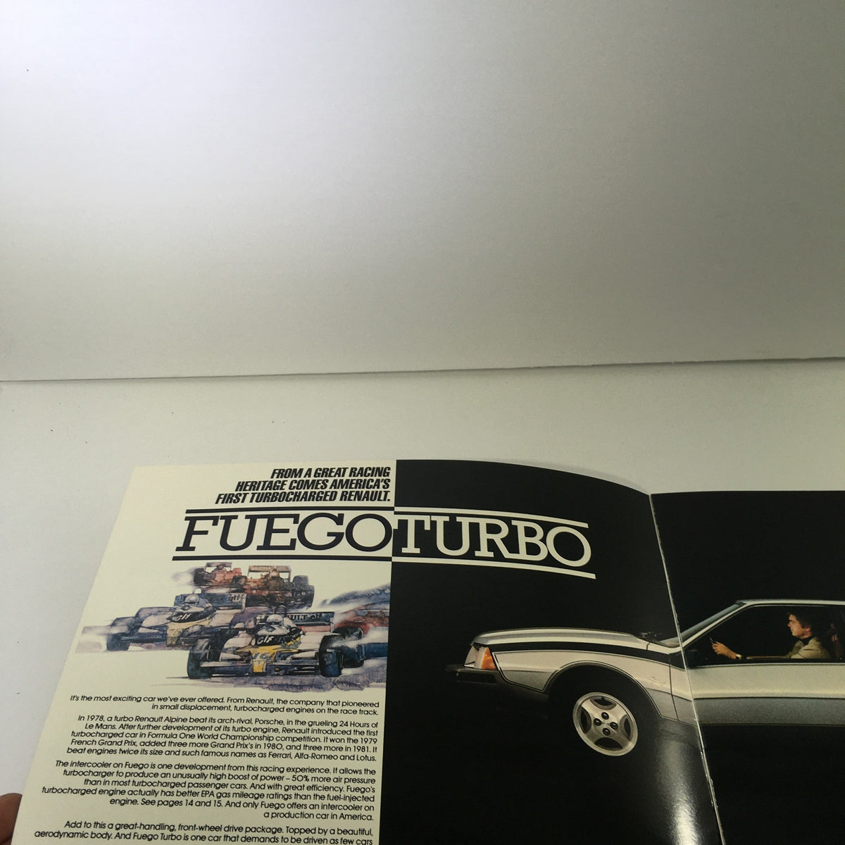 1984 Renault Fuego Turbo Coupe Dealership Car Brochure showcasing the Turbo model with a racing background and stylish exterior view.