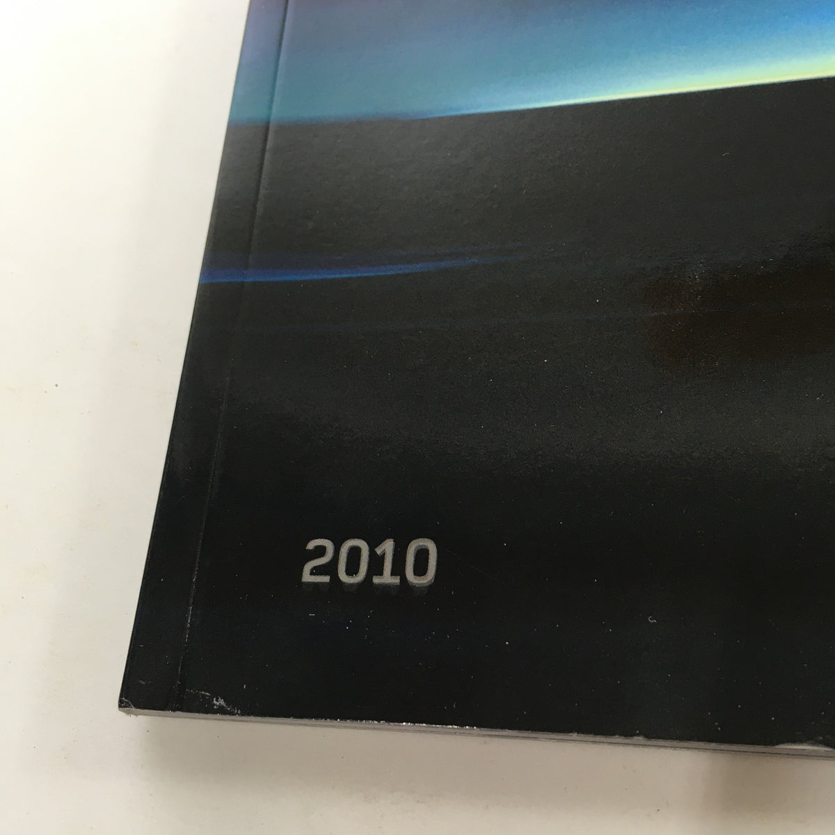 Close-up of the publication date '2010' on the 2010 Land Rover Range Rover Sport Dealership Car Auto Brochure Catalog.