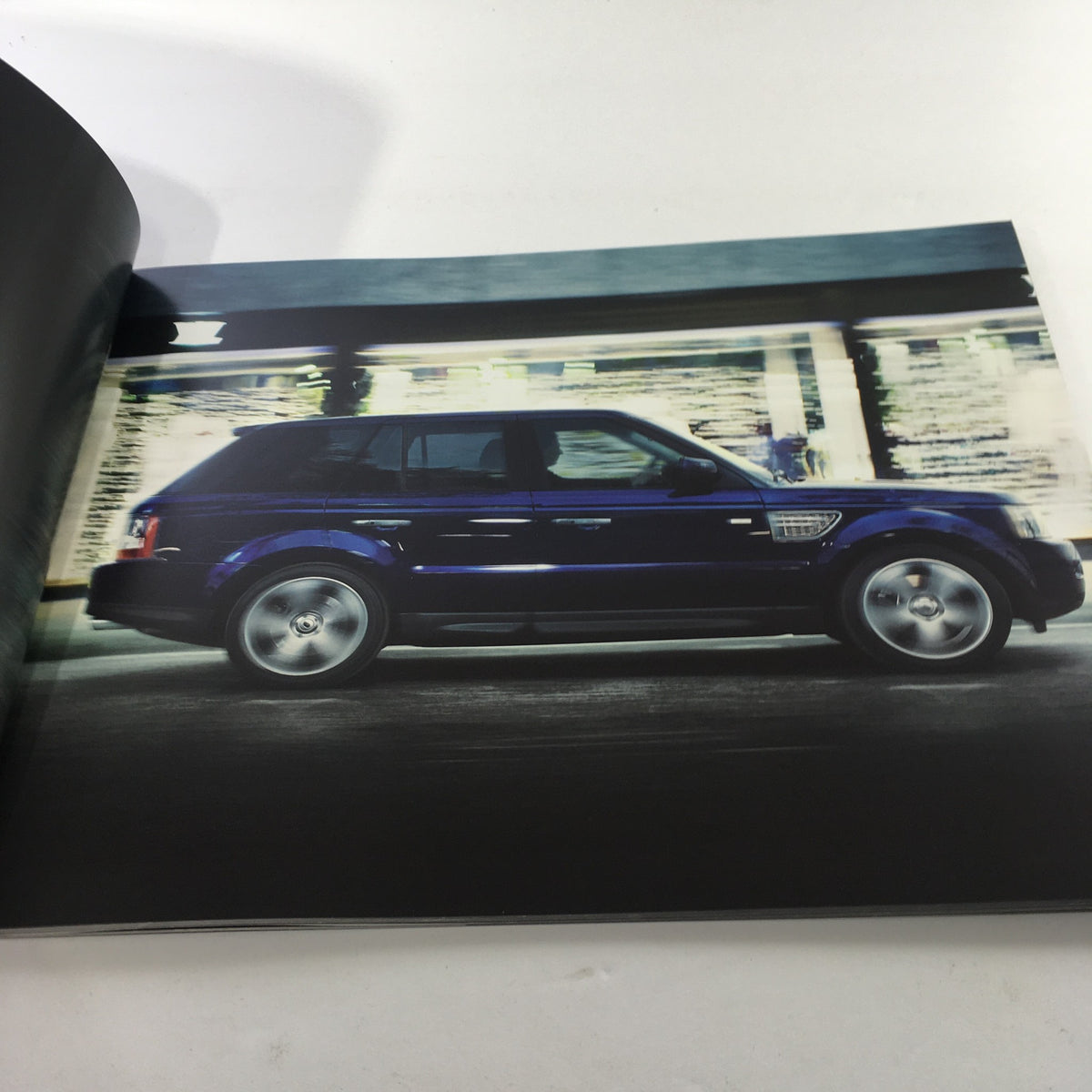 Interior page showcasing a side view of the 2010 Land Rover Range Rover Sport, highlighting its luxurious design.