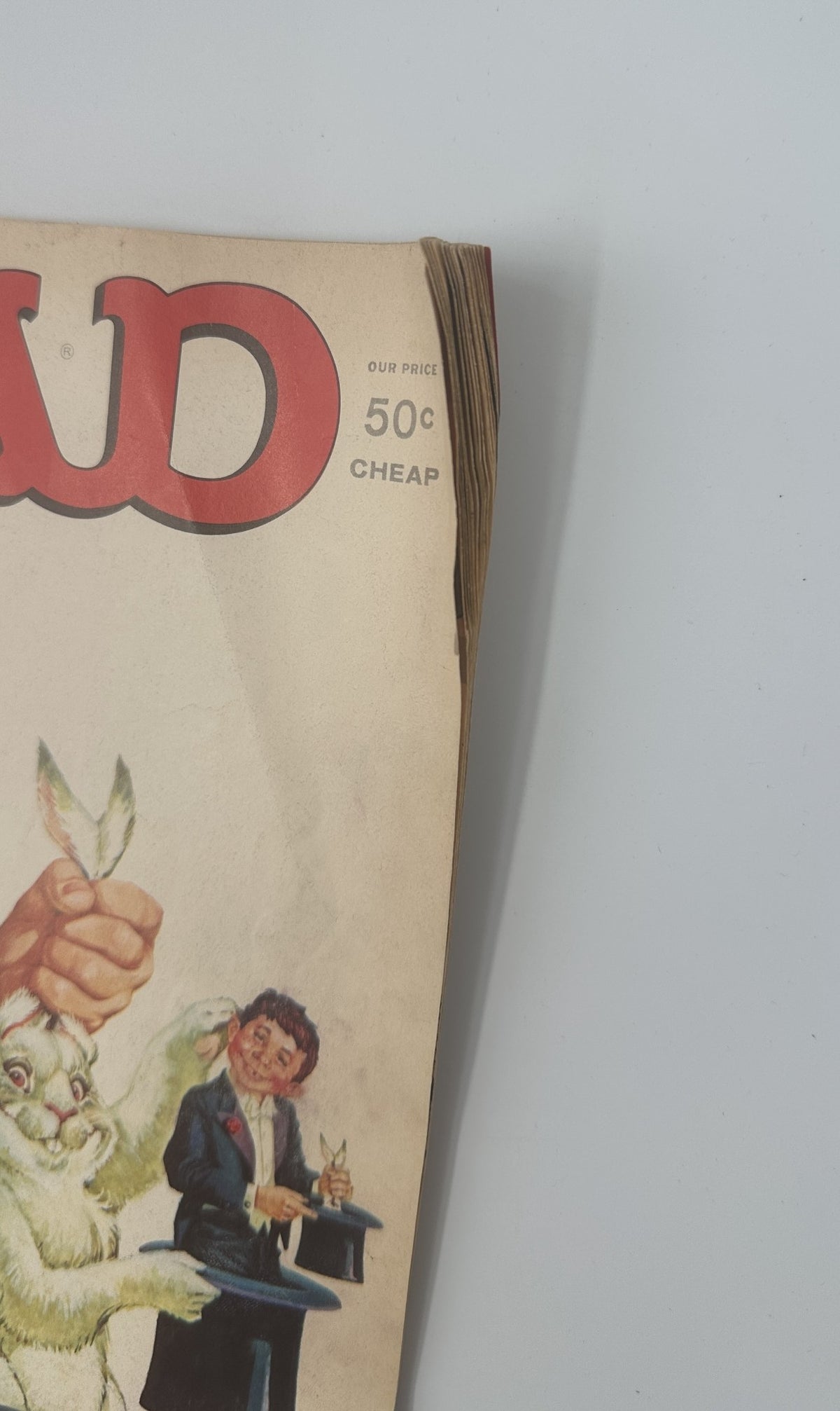 Close-up of the spine and cover edge of MAD Magazine No. 182 from April 1976, highlighting the magazine's vintage condition with slight wear.