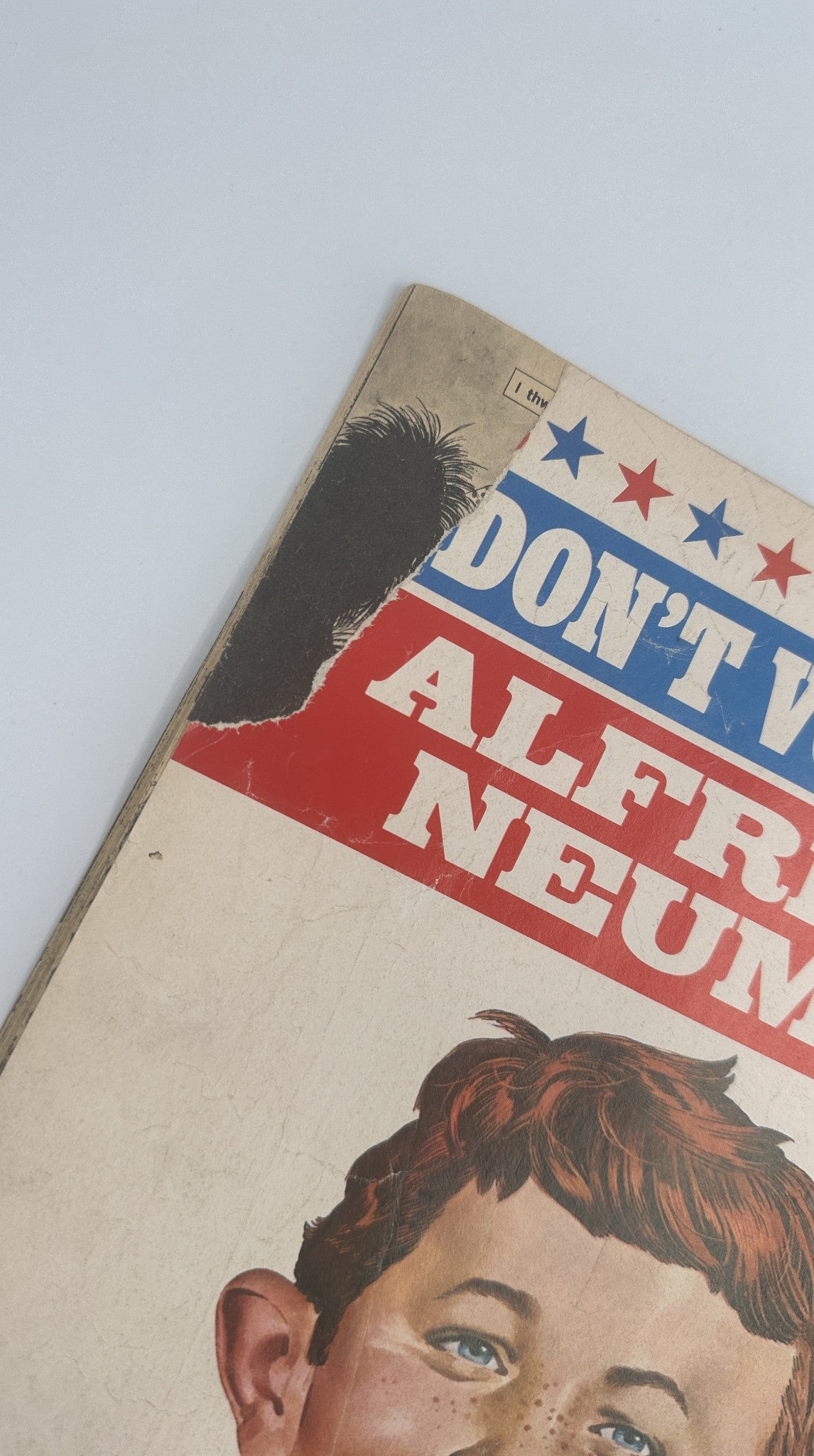 Close-up view of the spine and edge of MAD Magazine No. 187 from December 1976, highlighting wear and tear typical of a Very Good condition issue.