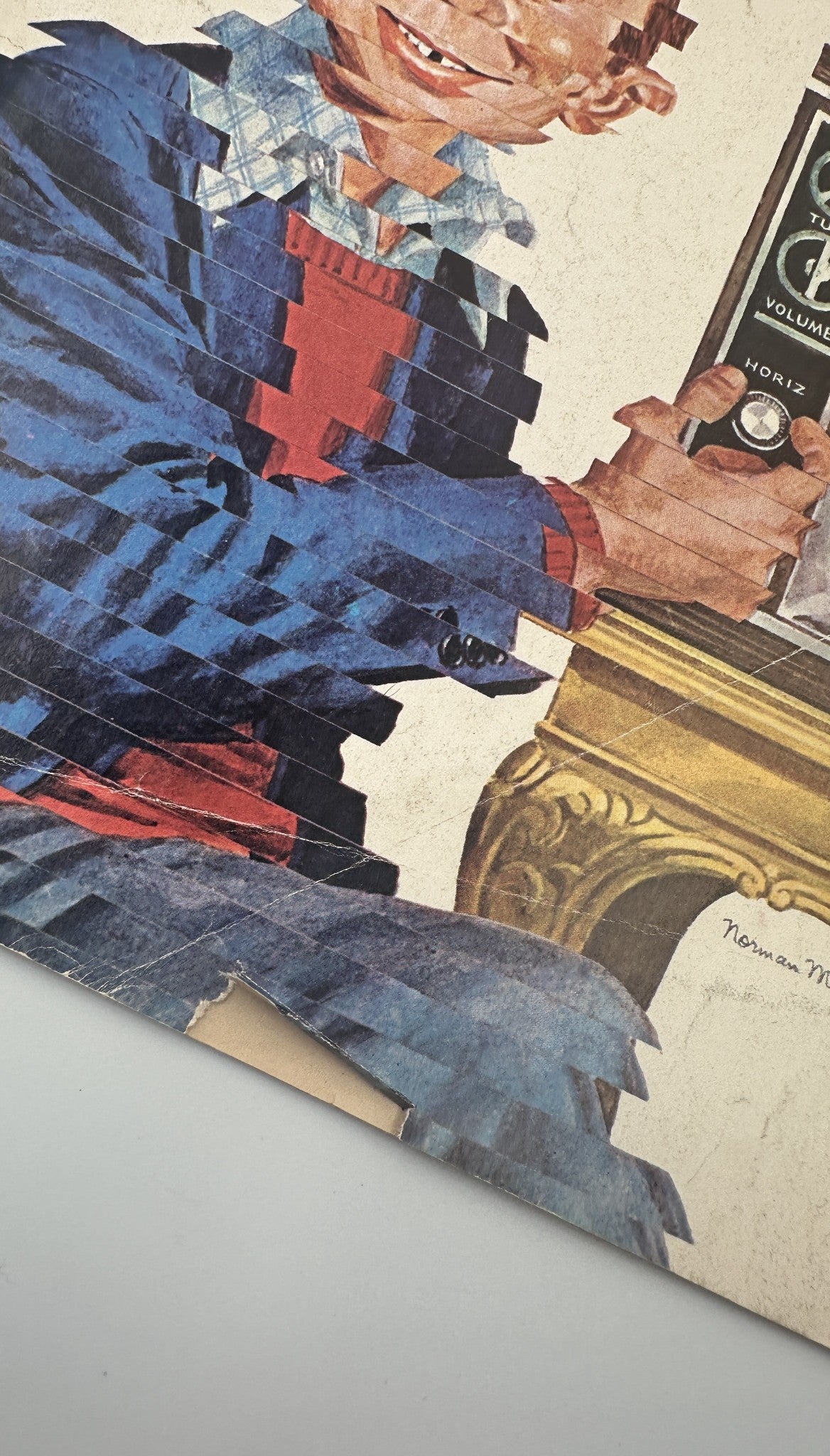 Close-up of the cover of MAD Magazine No. 160, July 1973, highlighting wear and creases, showcasing the character's playful expression and details of the television set.