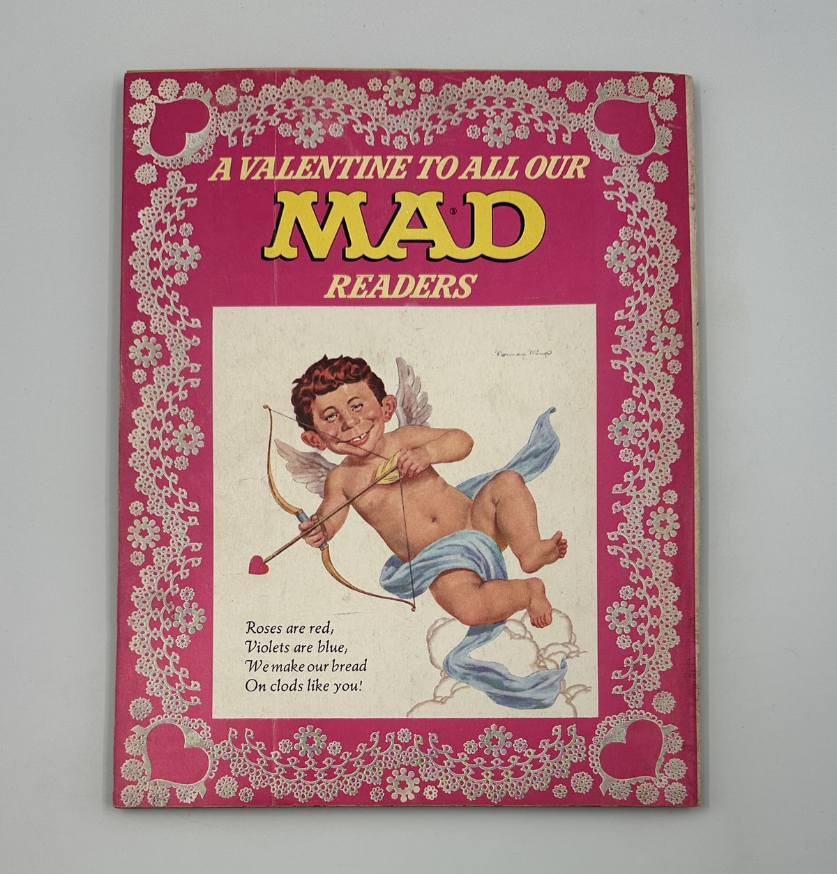 Cover of MAD Magazine Super Special 1973 No. 12 featuring a humorous illustration of Cupid with text 'A Valentine To All Our MAD Readers'. The magazine is in Fine (FN 6.0) condition, showcasing nostalgic artwork and classic MAD humor.
