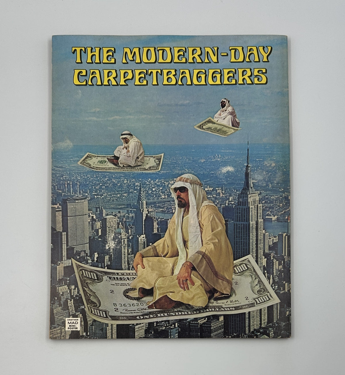 Cover of MAD Magazine Super Special No. 29, titled 'The Modern-Day Carpetbaggers', featuring a surreal image of an Arab figure sitting on a giant dollar bill above a city skyline with iconic buildings like the Empire State Building.