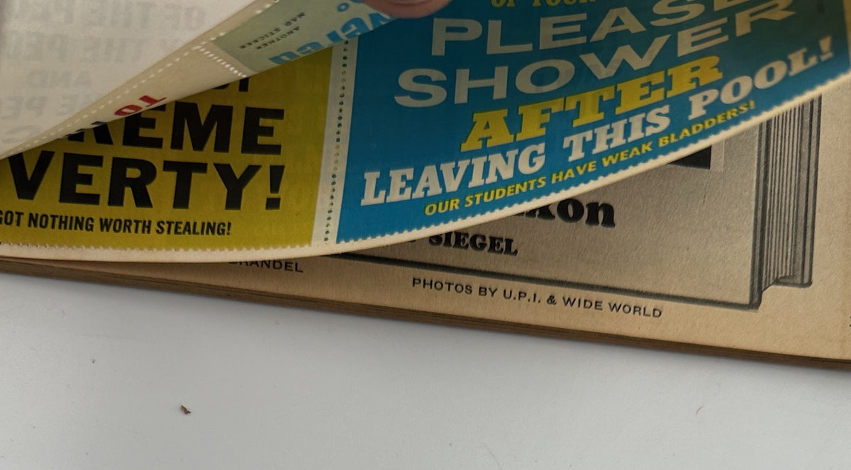 A fold-in page from MAD Magazine Super Special No. 13 1974 displaying a comedic advertisement with humorous slogans, illustrating the magazine's playful tone.