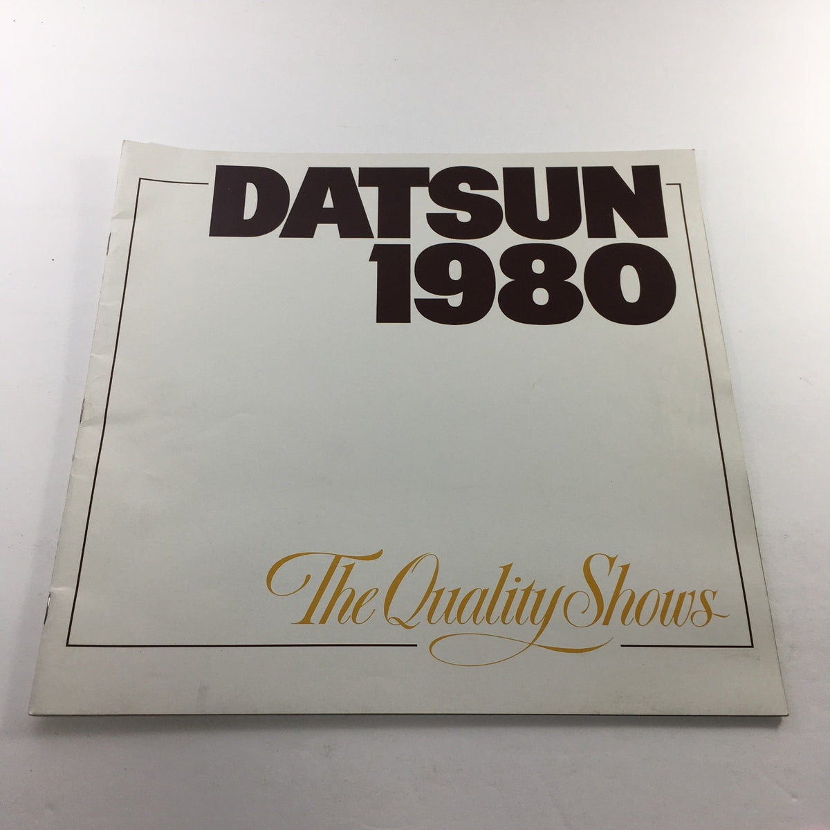 Cover page of the 1980 Datsun Quality Shows Dealership Car Auto Brochure Catalog featuring bold title design.
