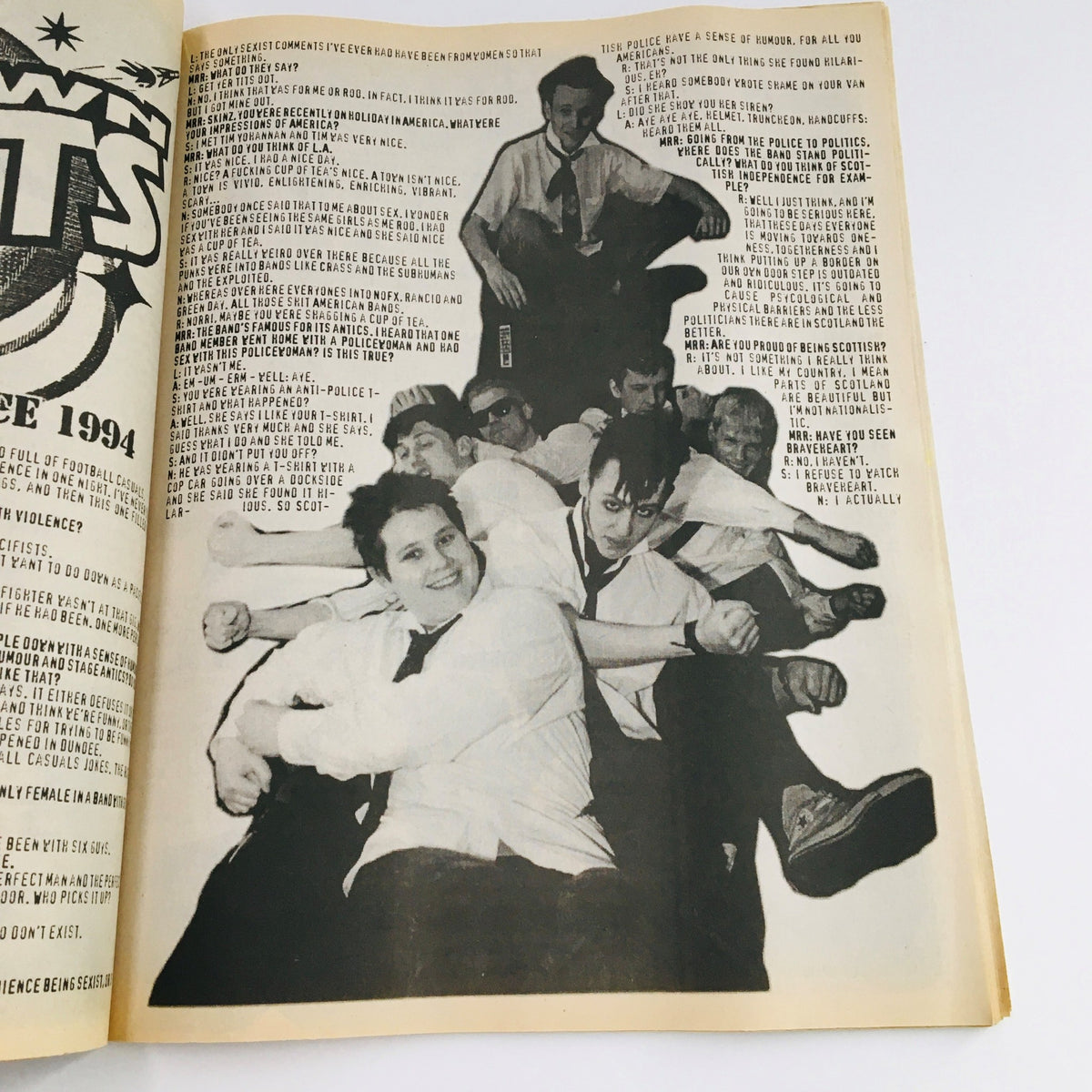 Another inside page of Maximum RocknRoll Magazine October 1996 #161 displaying a humorous article and punk aesthetic involving group photography.