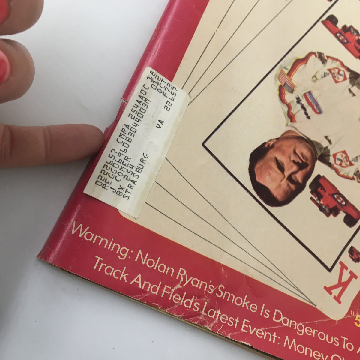 Close-up of the cover of VTG Sport Magazine June 1973, showing A.J. Foyt and a label indicating details about its condition. The magazine cover highlights the intersection of racing culture and collectible print history.