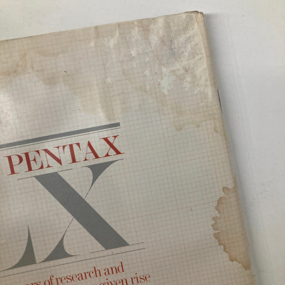 Close-up view of the Vintage Camera Arts Magazine May 1981 cover details, emphasizing the Pentax brand, hinting at its history and significance in professional photography.