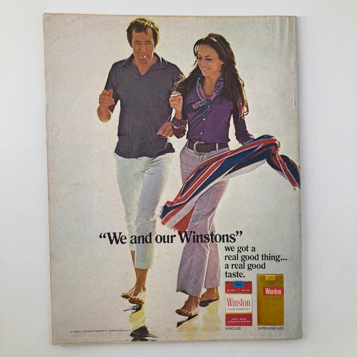 Cover of the May 1970 TV Radio Mirror Magazine featuring Johnny Cash and June Carter Cash, with vintage style advertising for Winston cigarettes, showcasing a couple in fashionable attire.