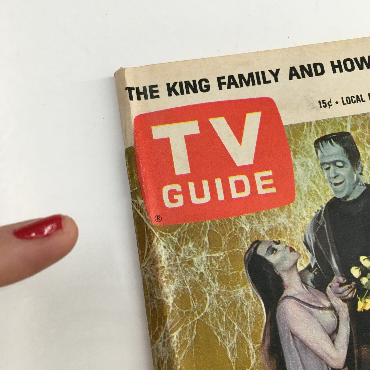Close-up of the cover of TV Guide Magazine July 10, 1965 featuring Yvonne DeCarlo and Fred Gwynne, with a vibrant design and iconic logo.