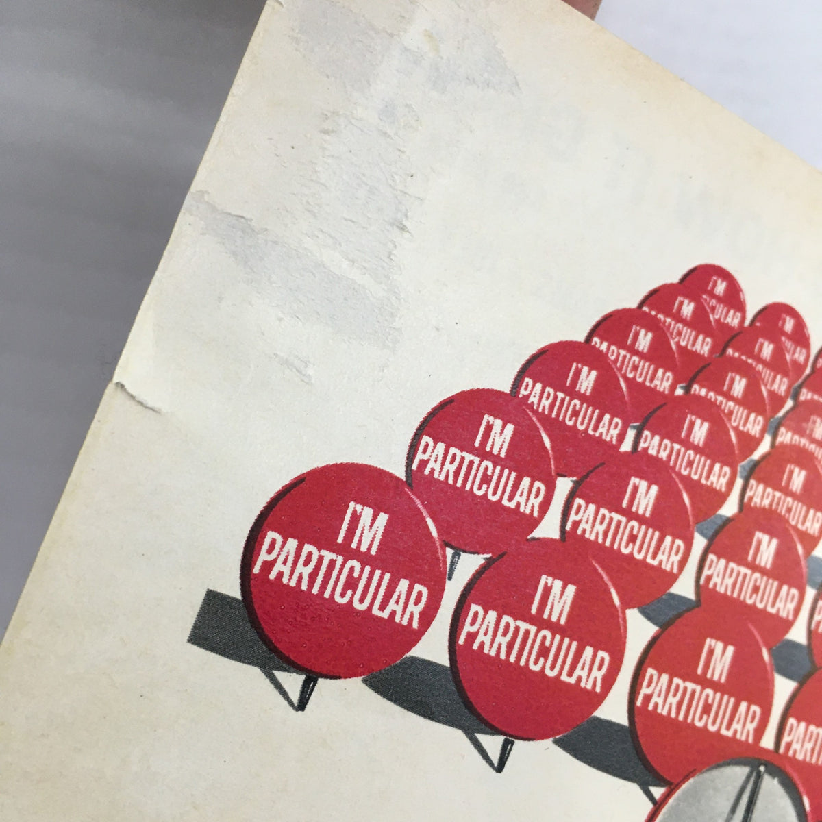Cover detail of TV Guide Magazine July 10 1965 featuring an illustration of red signs with the phrase 'I'M PARTICULAR' in bold white letters, capturing the essence of vintage advertising.